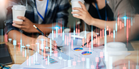 Business people read business statistics chart reports, to analyze and improve corporate strategy,...