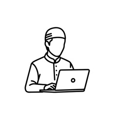 Person working on laptop in traditional attire with focused expression