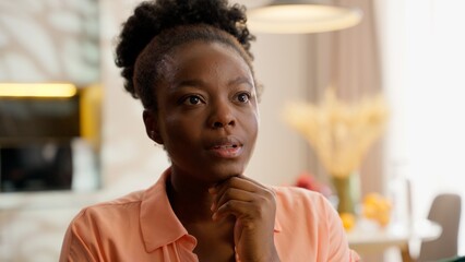 Stunned interested African American business woman homeowner businesswoman model female girl...