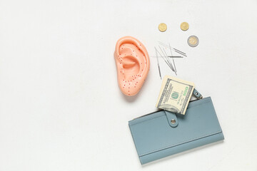 Acupuncture supplies with wallet and money on white background