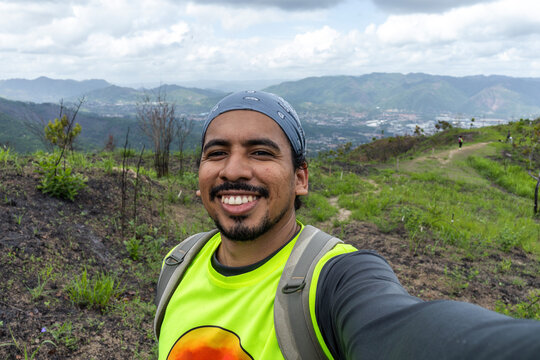 Cheerful middle-aged man hiking in the mountains of Waraira Repano National Park in Venezuela