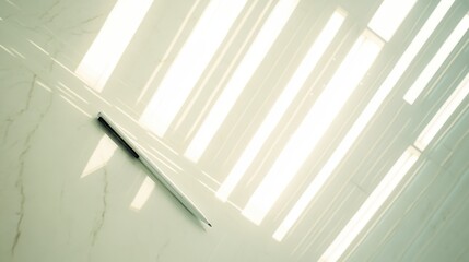 Light filtering through linear ceiling lights on a smooth surface.