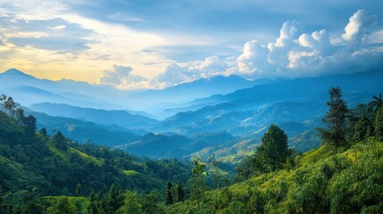 Fototapeta premium Majestic layered mountain range with vivid green foliage and a soft sky