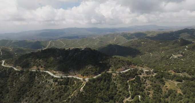Aerial view of Troodos Mountains and winding road, Cyprus.