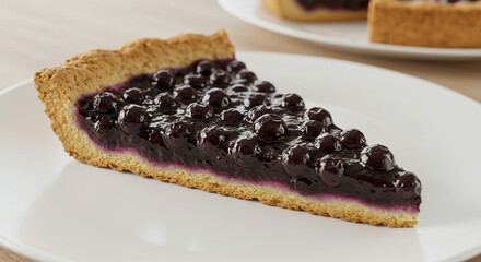 Close-up of a slice of blueberry pie on a white plate