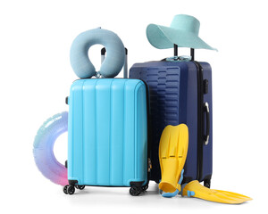 Suitcases with beach accessories isolated on white background