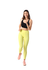 Sporty young woman running marathon on white background