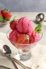 Tasty sorbet with strawberries and mint served on light table