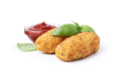 Tasty fried croquettes, basil and sauce isolated on white
