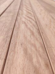 Close-up of wooden planks with natural grain texture used for flooring or furniture. Macro shot of...
