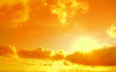 Orange sky with clouds during hot summer weather