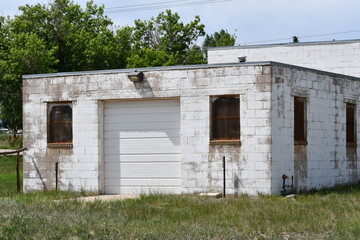 Old white colored brick building. 