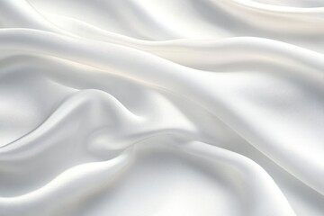 Obraz premium Soft white silk fabric with smooth, flowing folds and gentle light reflections creating a calming and luxurious texture