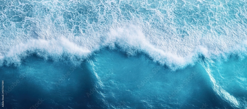 Poster aerial view of ocean waves crashing with white foam and deep blue water creating textured patterns