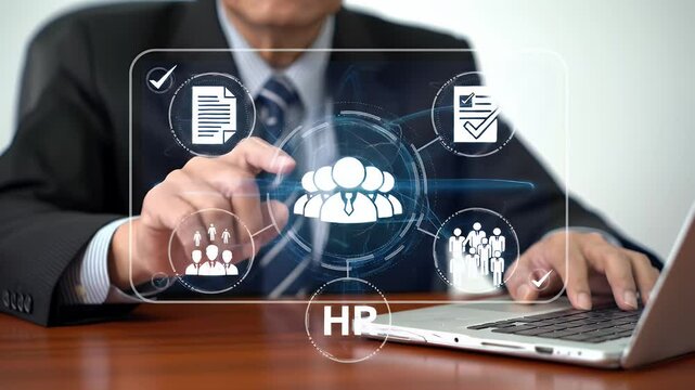 Senior Business Man Analyzing Online Team Connection Data Using Laptop at Desk in an Office Setting with Digital HR Graphic Interface Overlayed