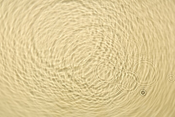 Texture of water drops on beige background, closeup