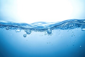 Clear blue water surface with bubbles rising underwater under bright lighting
