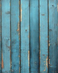 Close-up of weathered vertical wooden planks painted blue with peeling and chipped paint showing natural wood underneath