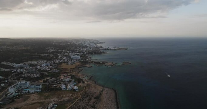 Aerial view of Cyclops Cave and coastal town, Cyprus.