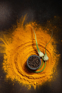 Turmeric, black pepper, garlic flowers 