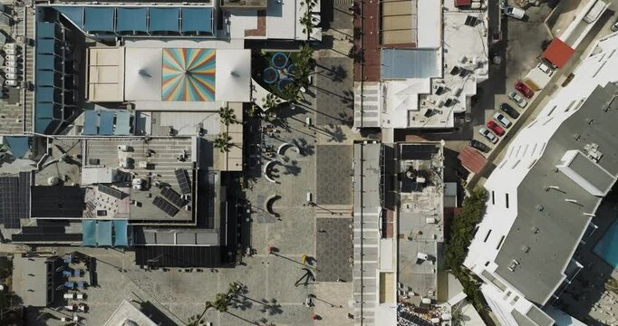 Aerial view of colorful buildings and palm trees, Cyprus.