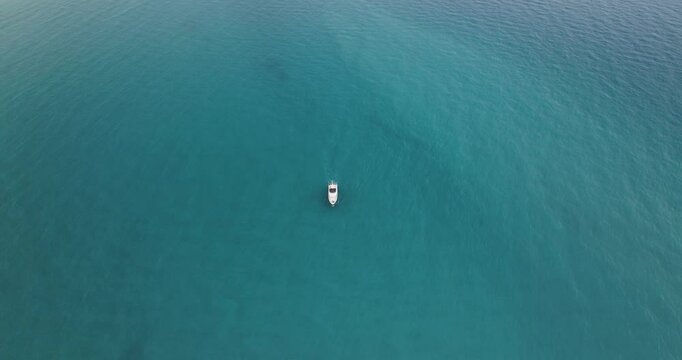 Aerial view of serene coastline with boats, Cyprus.