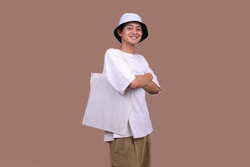 Mockup For Design. Young Man With Cotton Bag Over Beige Background.