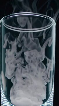 Glass With Dry Ice Rising Within It 