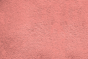 Fototapeta premium pink red coral new modern cement stucco in plaster wall concrete background textured. Pattern texture close up rose color colour backdrop.