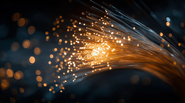 Illuminated Fiber Optic Cables: The image is a captivating close-up of fiber optic cables, radiating with light, symbolizing the flow of information and communication in the digital age.