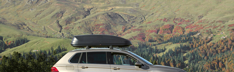 Silvery large SUV car stands on meadow on Caucasian mountains background. side view vehicle  ruff...