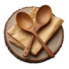 Two handcrafted wooden spoons are crossed on a stack of beige napkins and a round wooden slice, isolated on transparent background