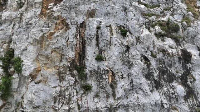 Chalk structure on artificial mountain after quarry mining. Technogenic rock formed during mine. Mountain hill with chalk fossil and limestone