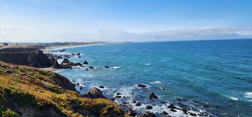 Rocky Shoreline on a Clear Day – Pacific Coast Scene