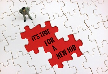 puzzle and statue of a person with the words '" it's time for a new job " on a red background