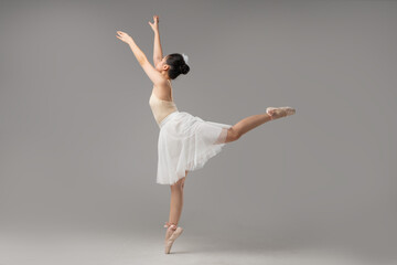Elegant ballet dancer in arabesque pose with grace Classical ballet art and beauty displayed