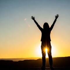 Fototapeta premium Woman Silhouette with Arms Raised at Sunset 