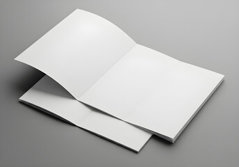 Open magazine mockup featuring blank white pages on a gray surface, ready for content.
