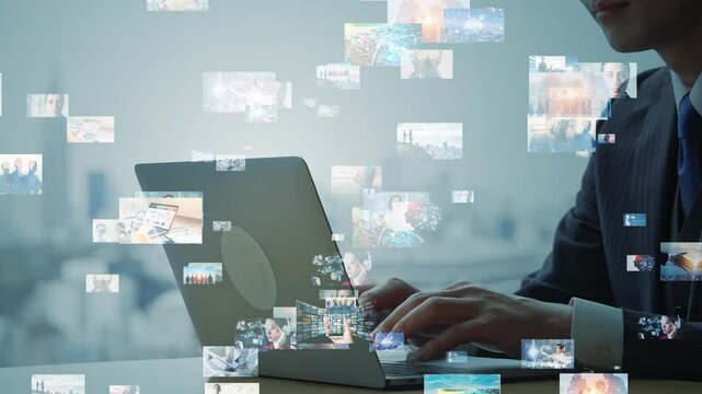 ノートパソコンを使うビジネスパーソンとデジタルコンテンツのコンセプト