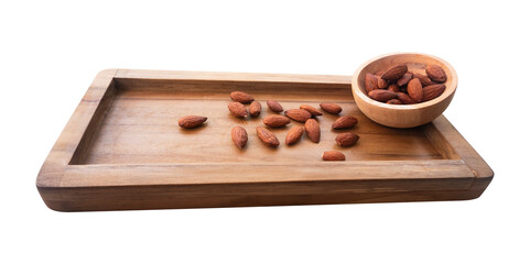 almond in a wooden bowl on a wooden plate