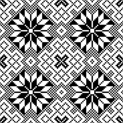 pixel art pattern of snowflakes. The snowflakes are arranged in a diamond shape and are of varying sizes. design for all business