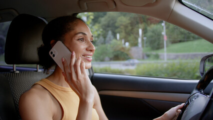 African American woman driving steering wheel driver car auto automobile transport vehicle call...