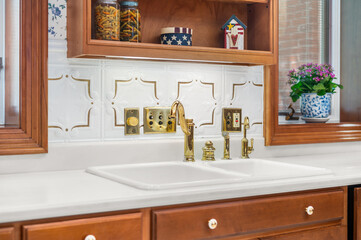 Luxury kitchen design with stylish gold sink fixtures