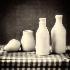 Monochrome still life with bottles fruit