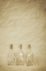 Aged bottles with plastic wrap covering