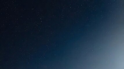 Dark blue night sky showing numerous tiny stars and celestial galaxy background