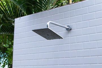 head shower at swimming pool. Shower area next to swimming pool in resort, hotel, pool villa...