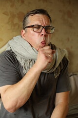 The man in the scarf became very ill.