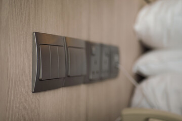 Light switches and power outlets in a cozy bedroom setting