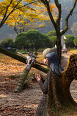 statues of angel and Jesus on the cross
